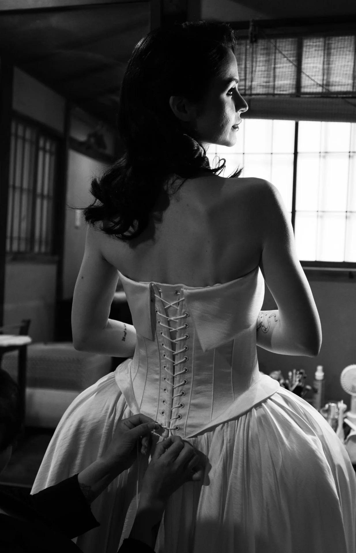 Hand finishing the corset of a LINH DOAN bridal gown