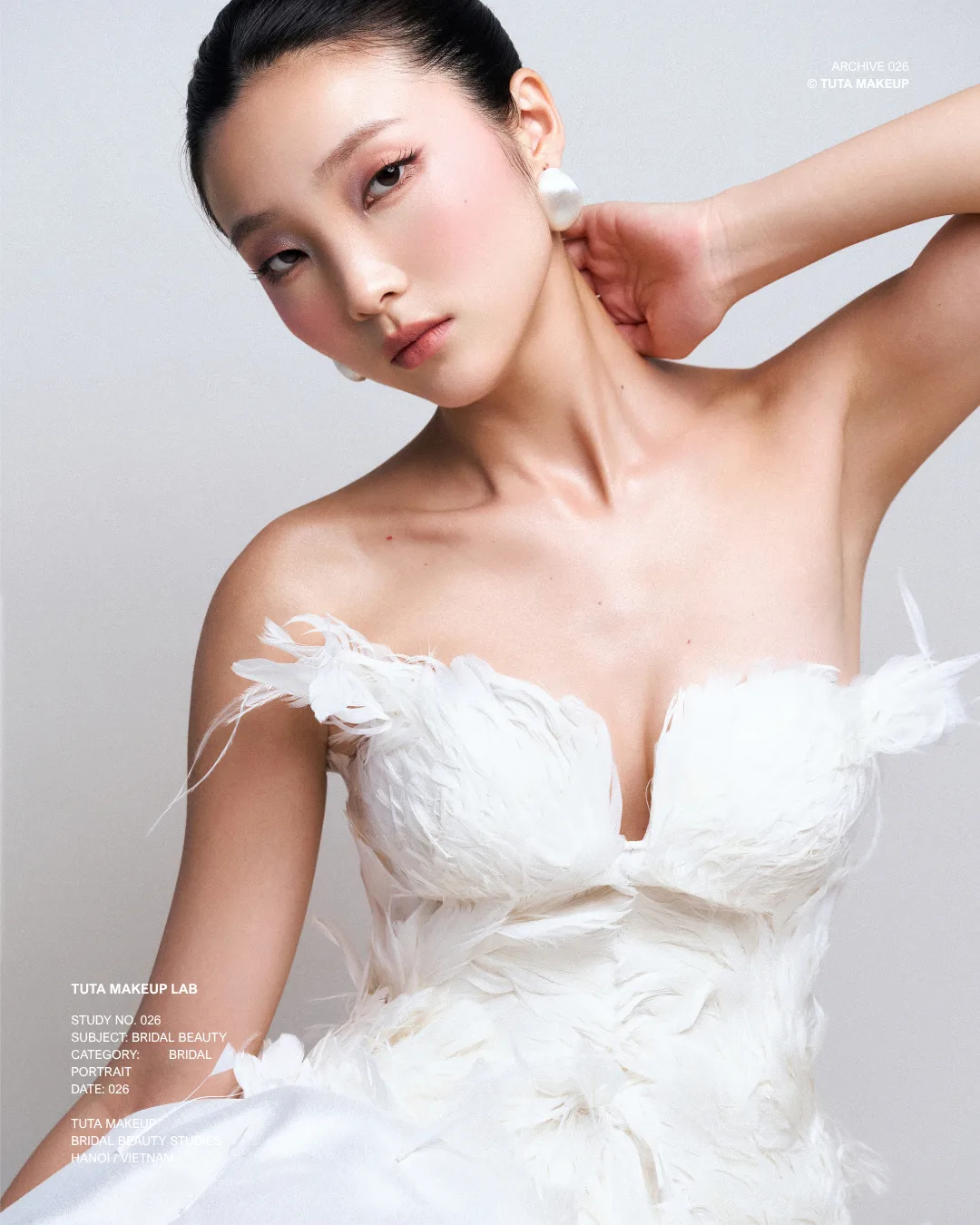 Natural bridal makeup by TUTA paired with an embellished white bridal gown