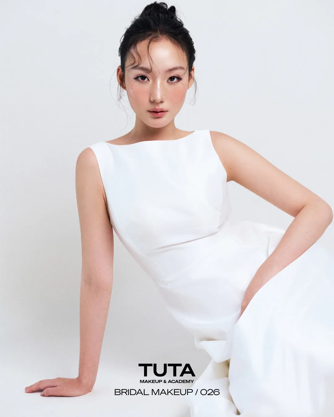 Modern bridal portrait with natural makeup by TUTA and a white gown
